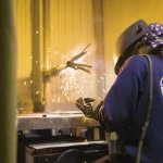 Image of a Welder practicing in the lab