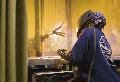 Image of a Welder practicing in the lab